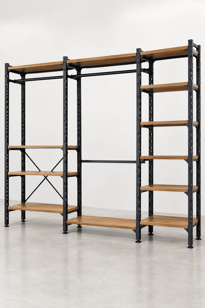 A modular industrial closet organizer rack with black metal framing and light brown wood color steel shelves, shown in a clean studio setting.