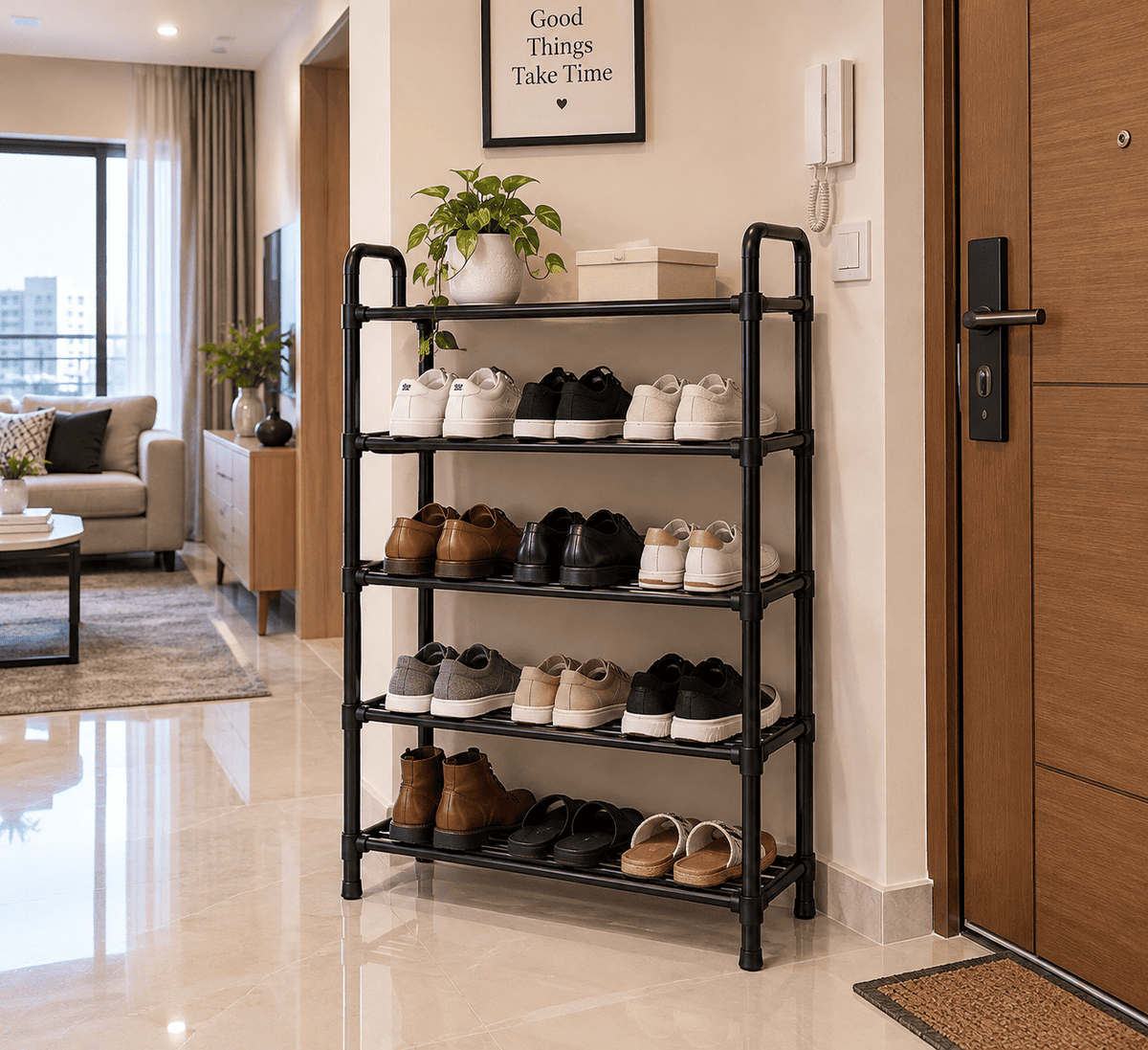 Black 5-tier home shoe rack holding shoes and sandals in an apartment entryway near the front door.