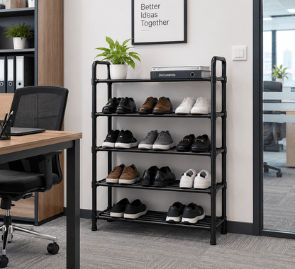 Black 5-tier shoe rack holding sneakers and shoes in an office next to a desk and chair.